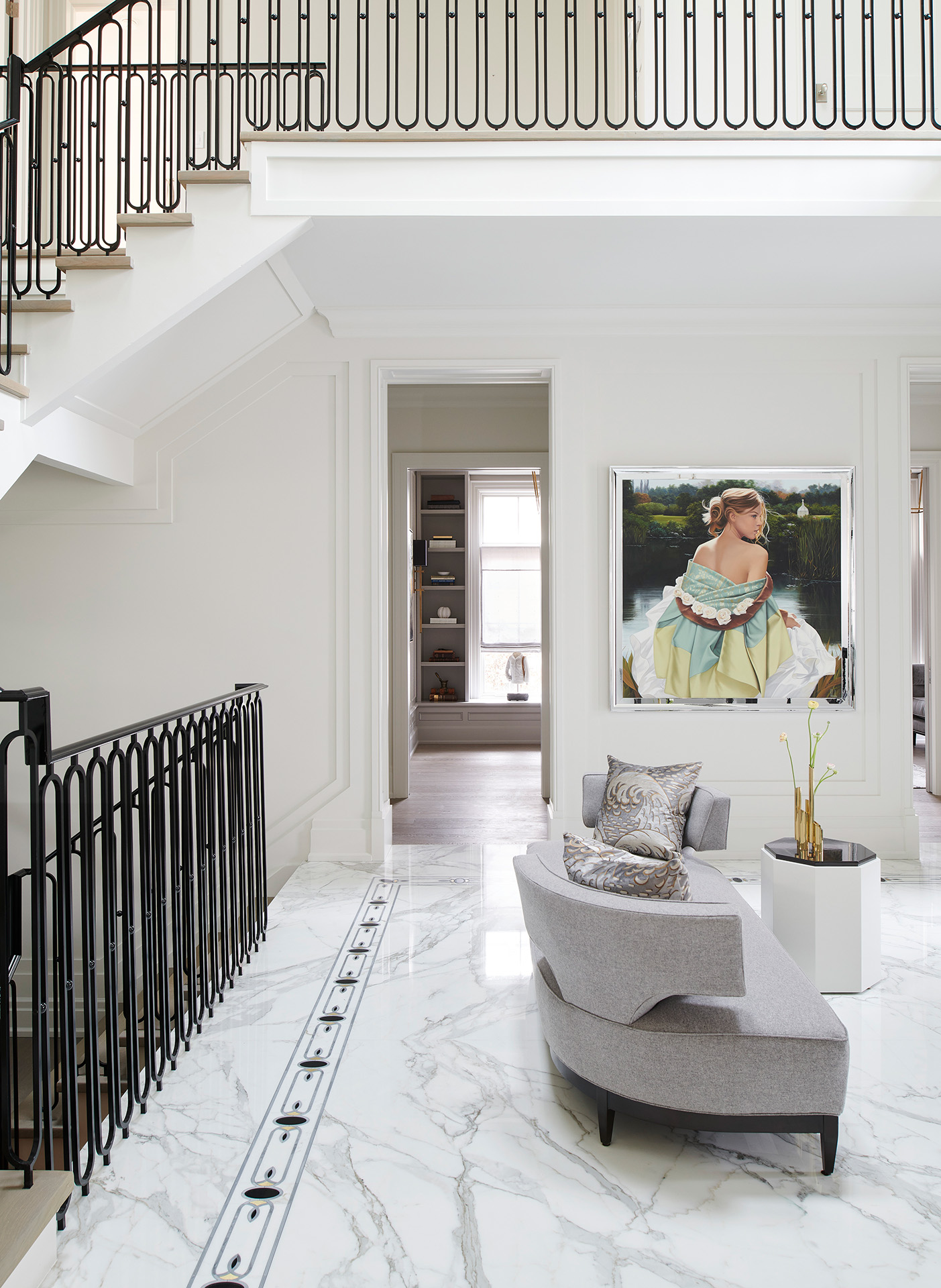 Chateau on the lake - living room with grey couch and large picture of a woman in a colorful dress