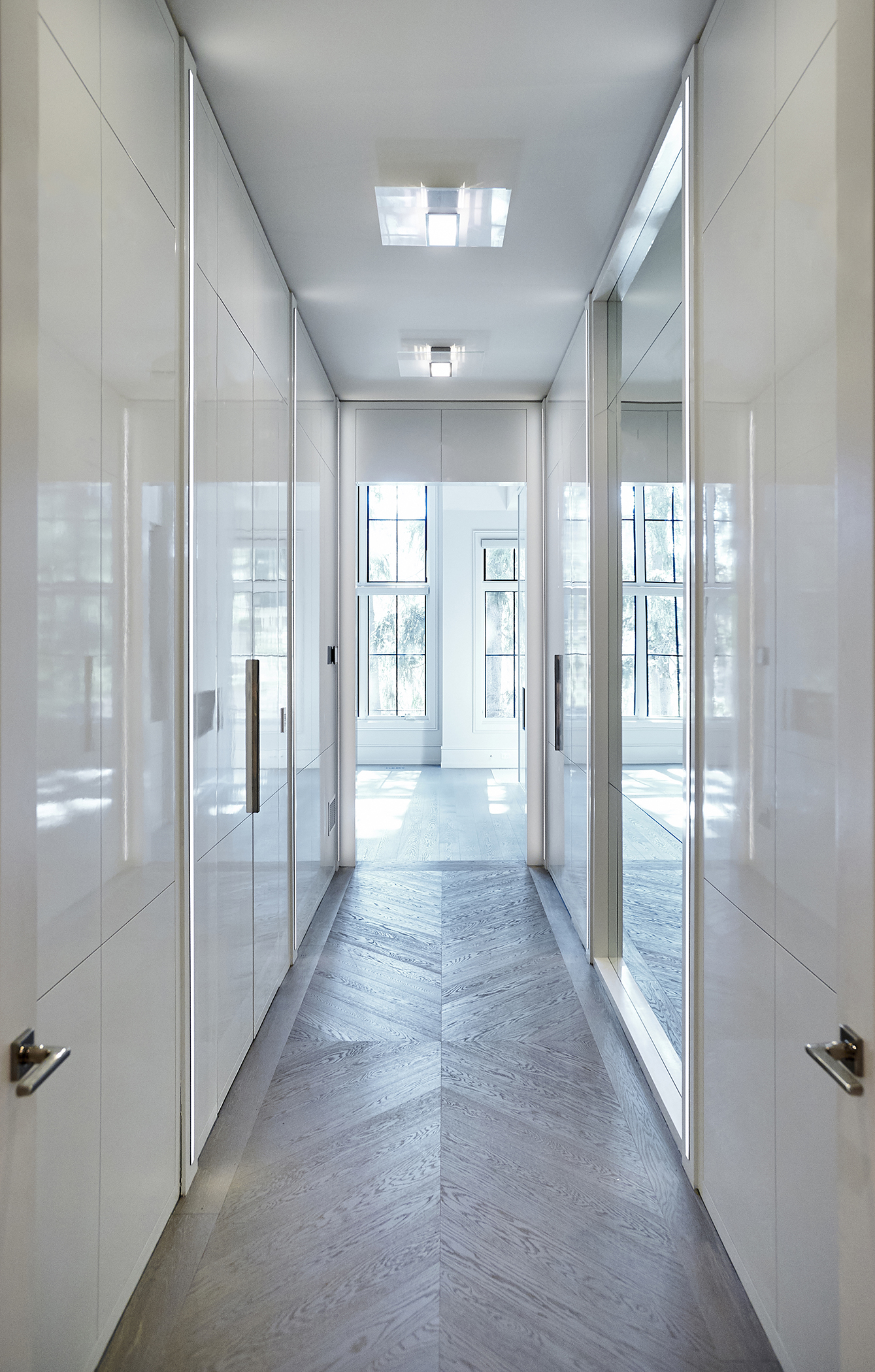 White hallway of cabinet doors