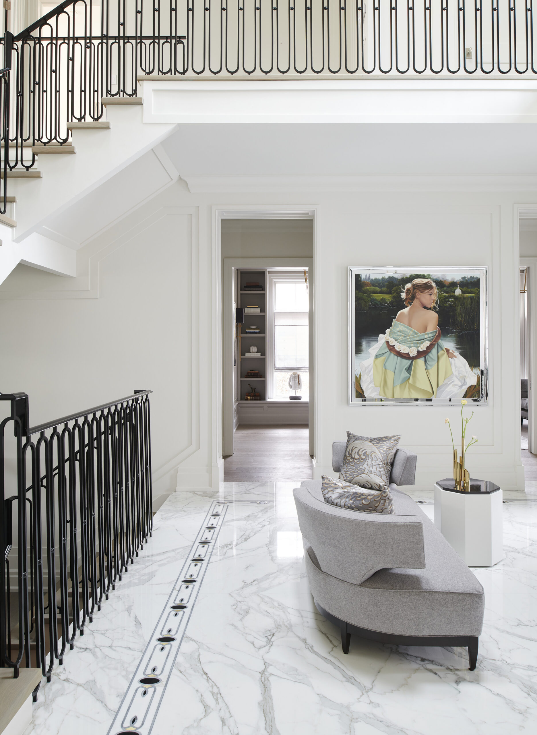 Living room with a huge painting on the wall of a woman in colorful clothes