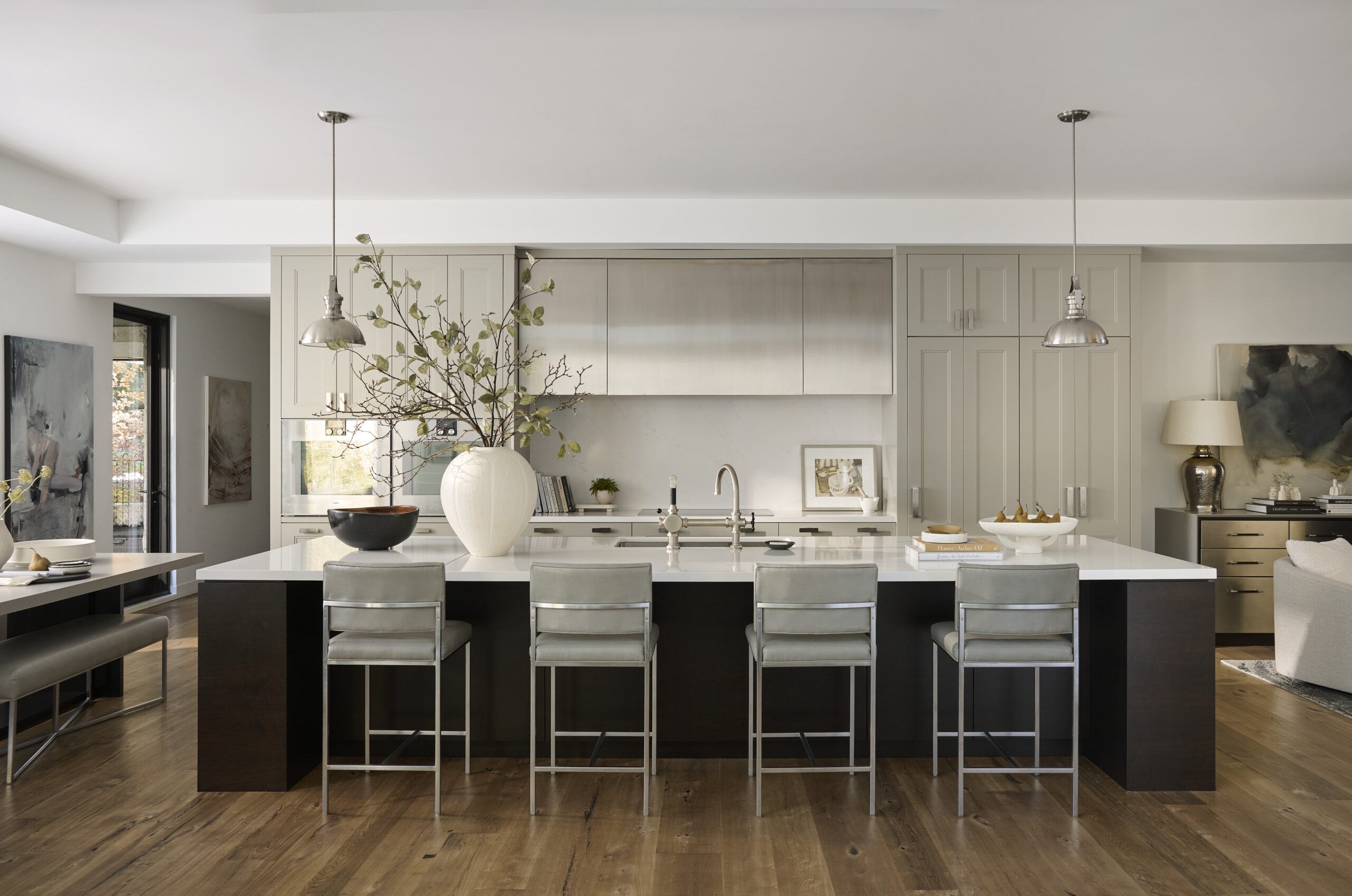 Kitchen with large island and stools.