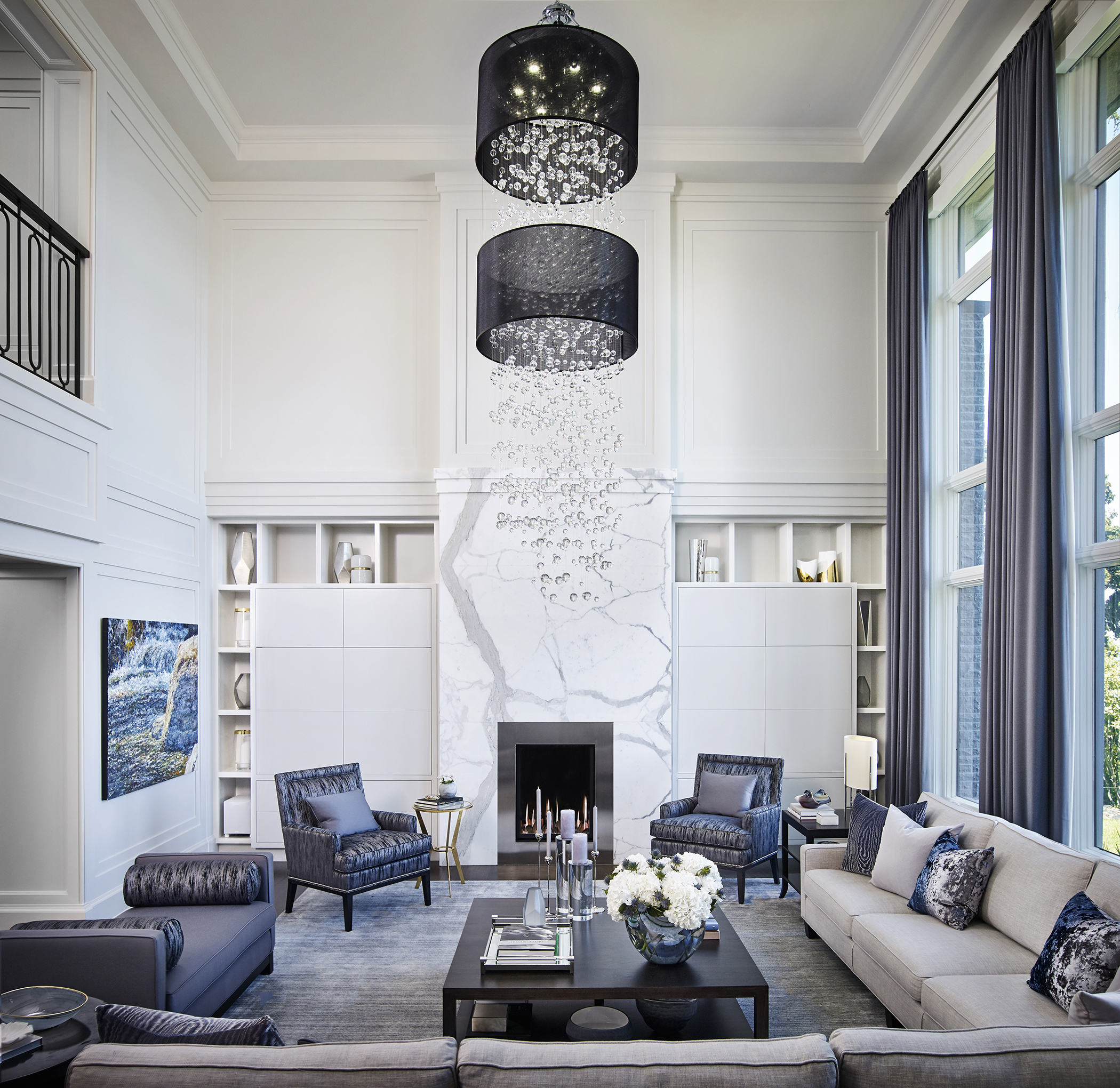 Living room with large chandelier of dangling glass balls