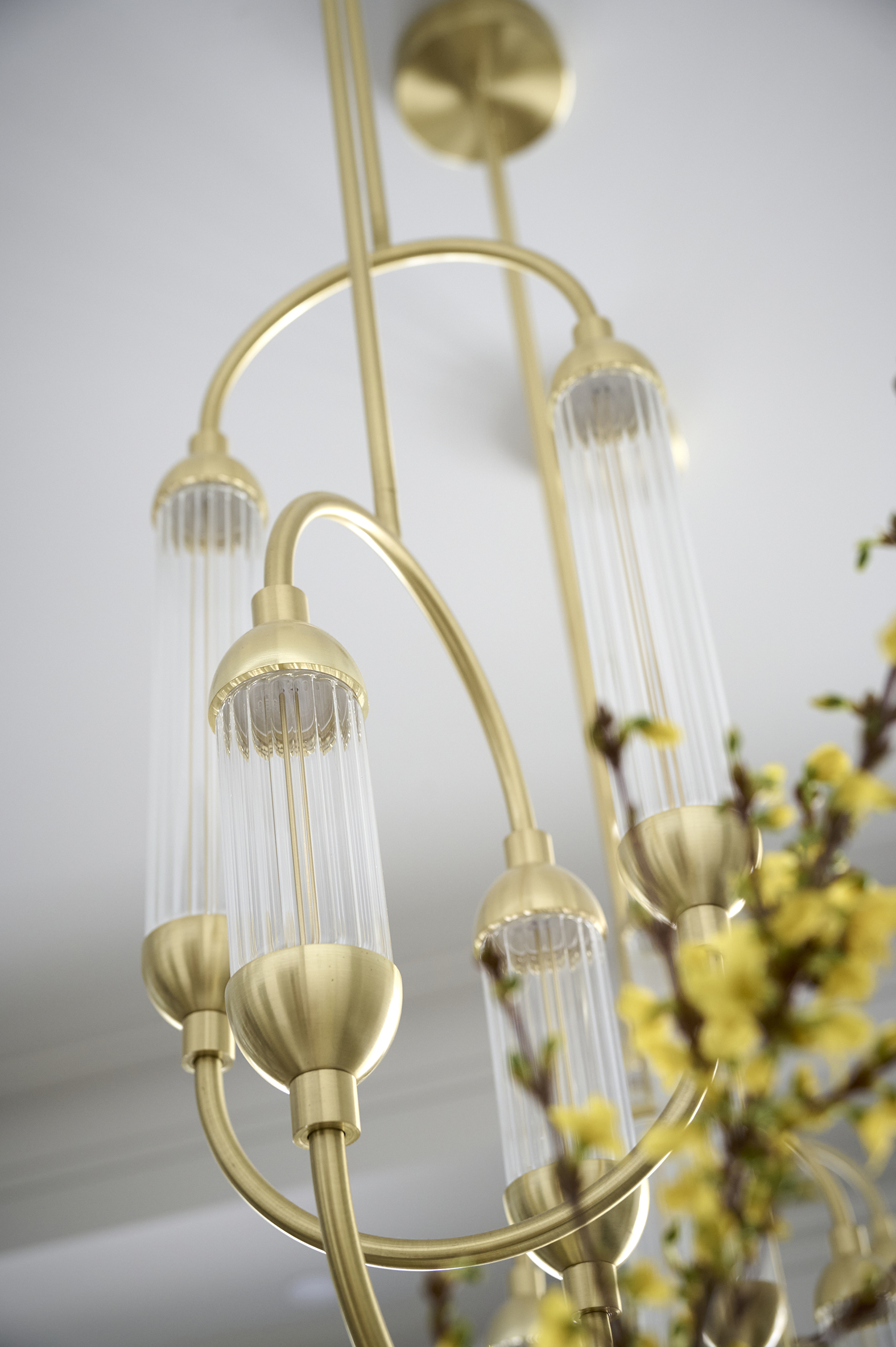 Close up of a golden chandelier in a kitchen