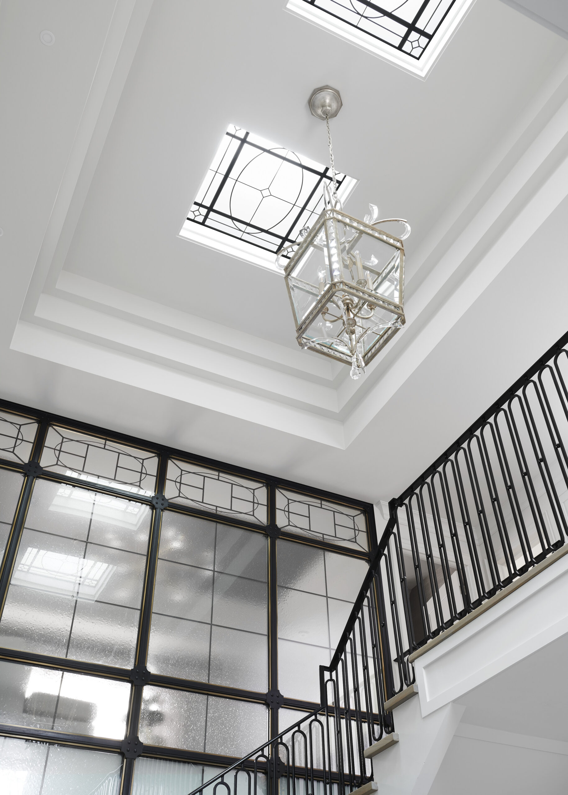 Chateau on the Lake - Ceiling details, chandelier and stair railing