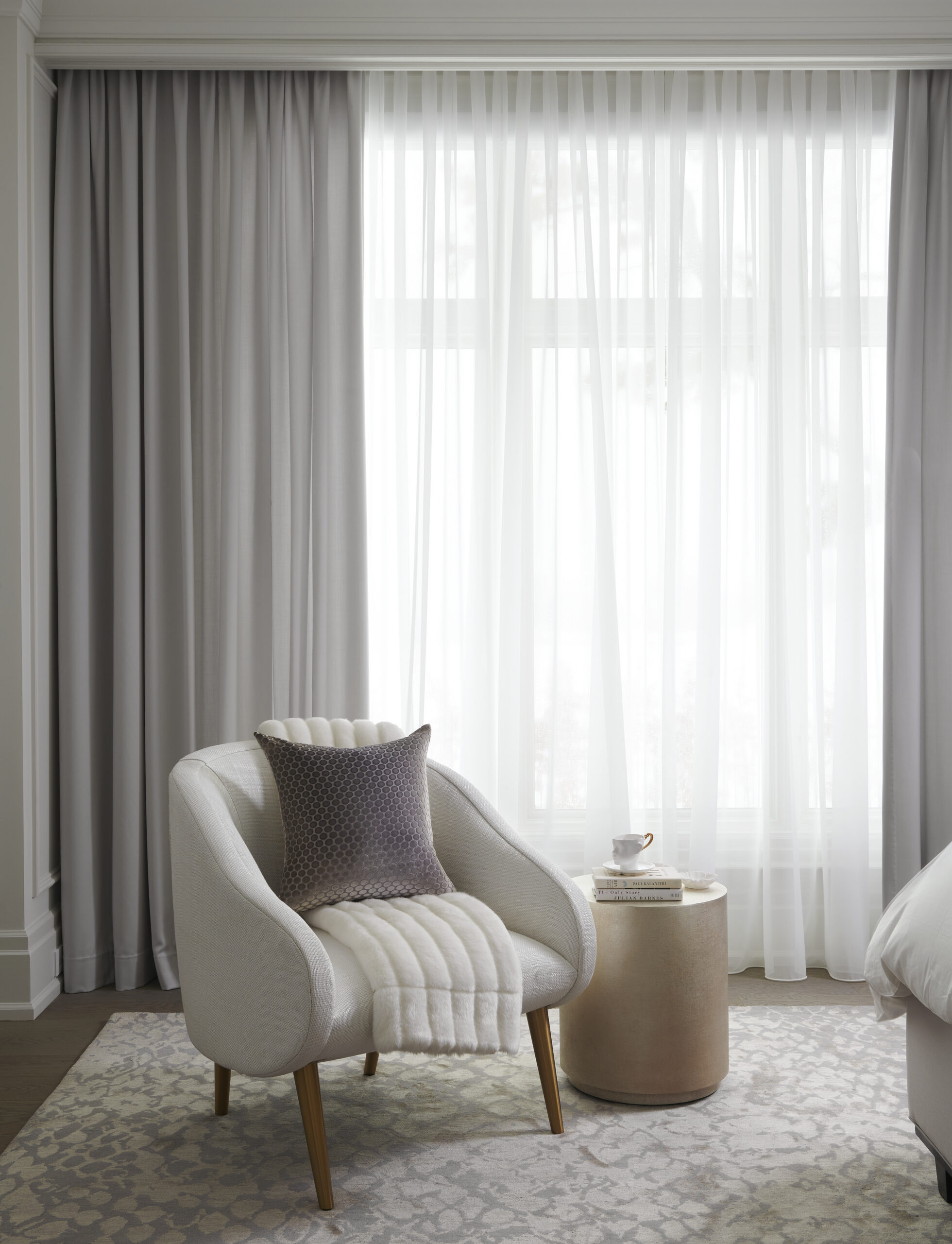 Cozy white chair in a bedroom