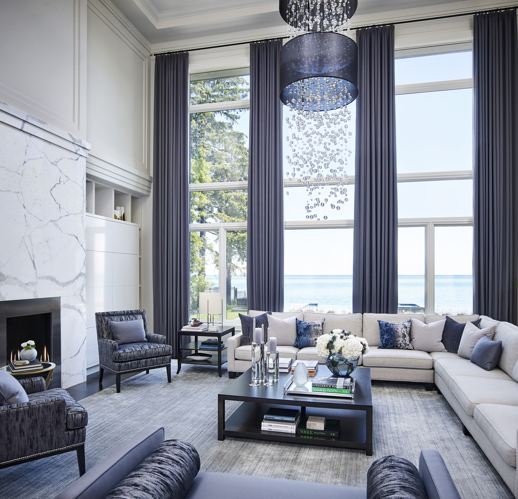 Living room with large windows with view of water