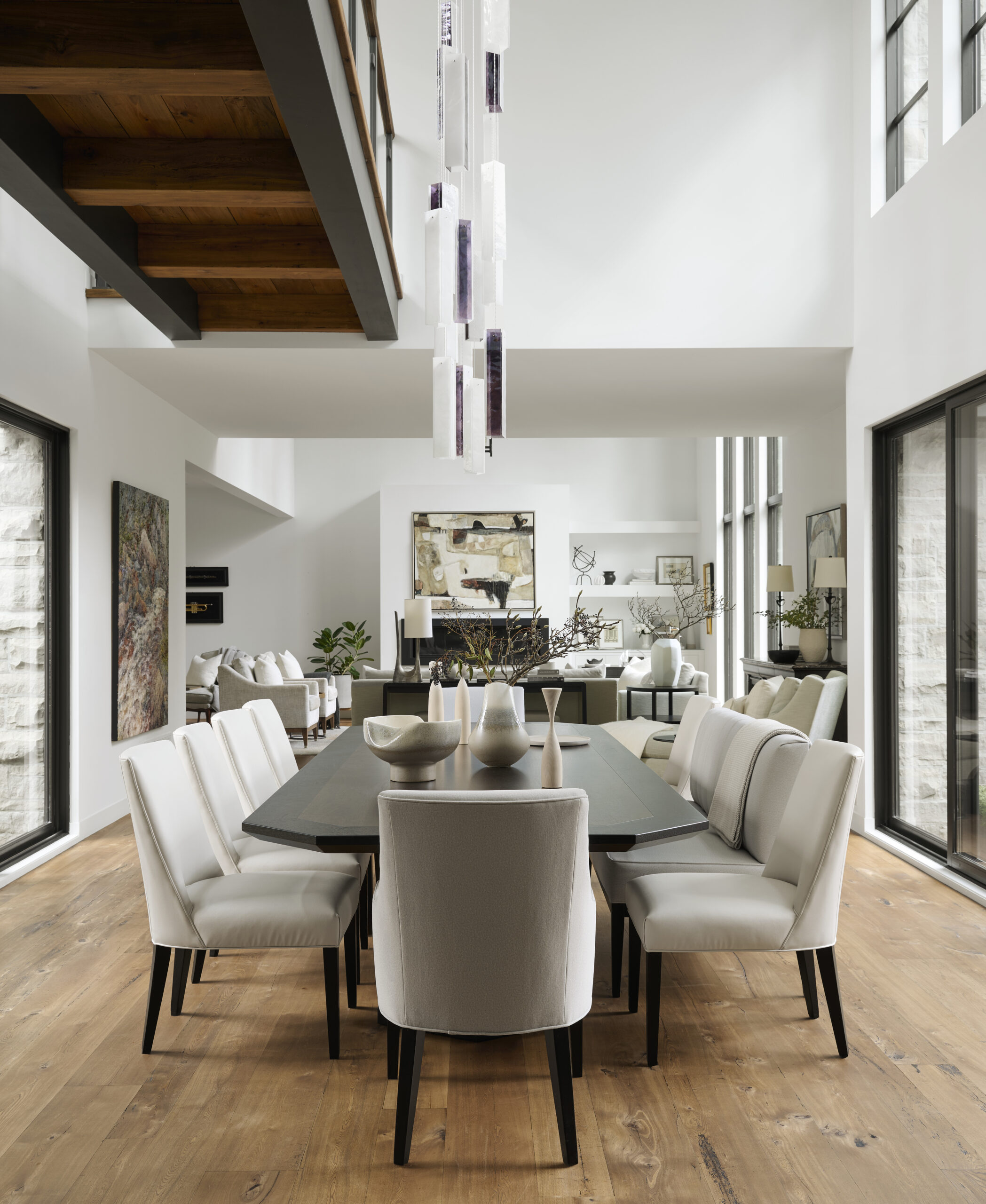 Open concept dining room with living room in the background