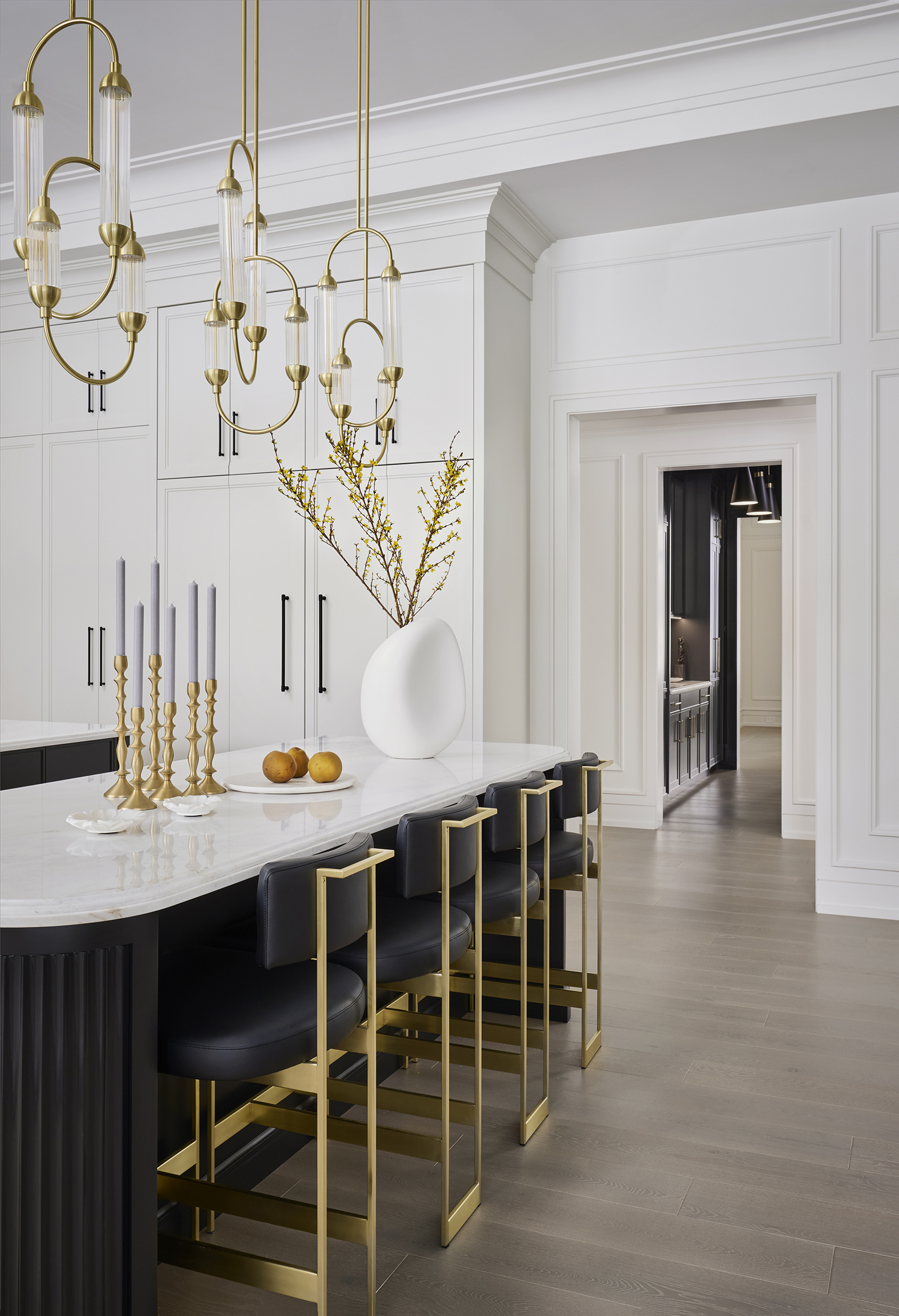 Matte finished islands and leathered stools with gold legs