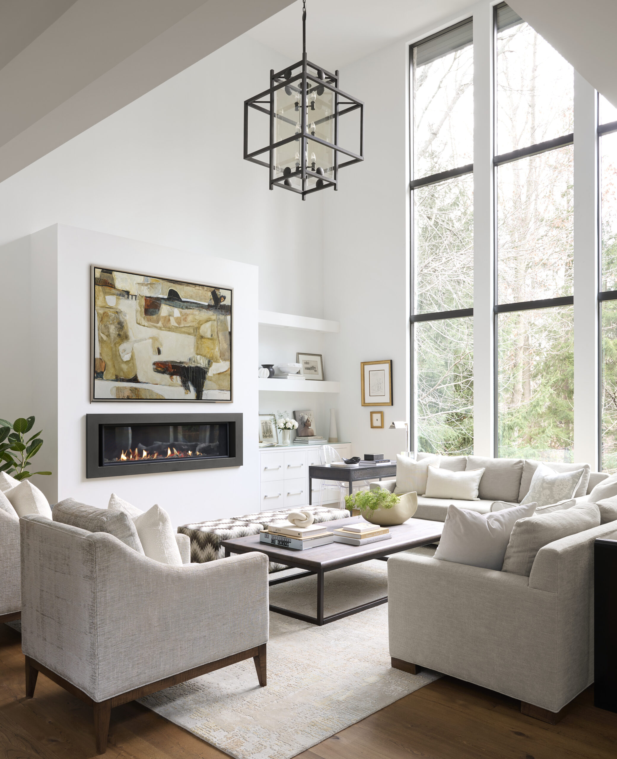 Living room with tall windows and a fireplace