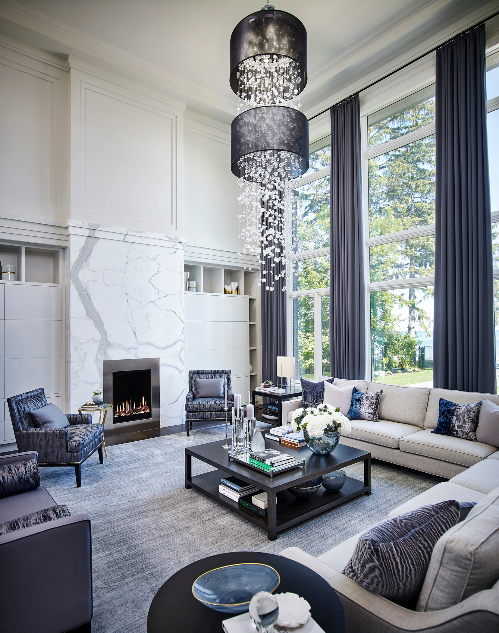 Living room with large chandelier of dangling glass balls