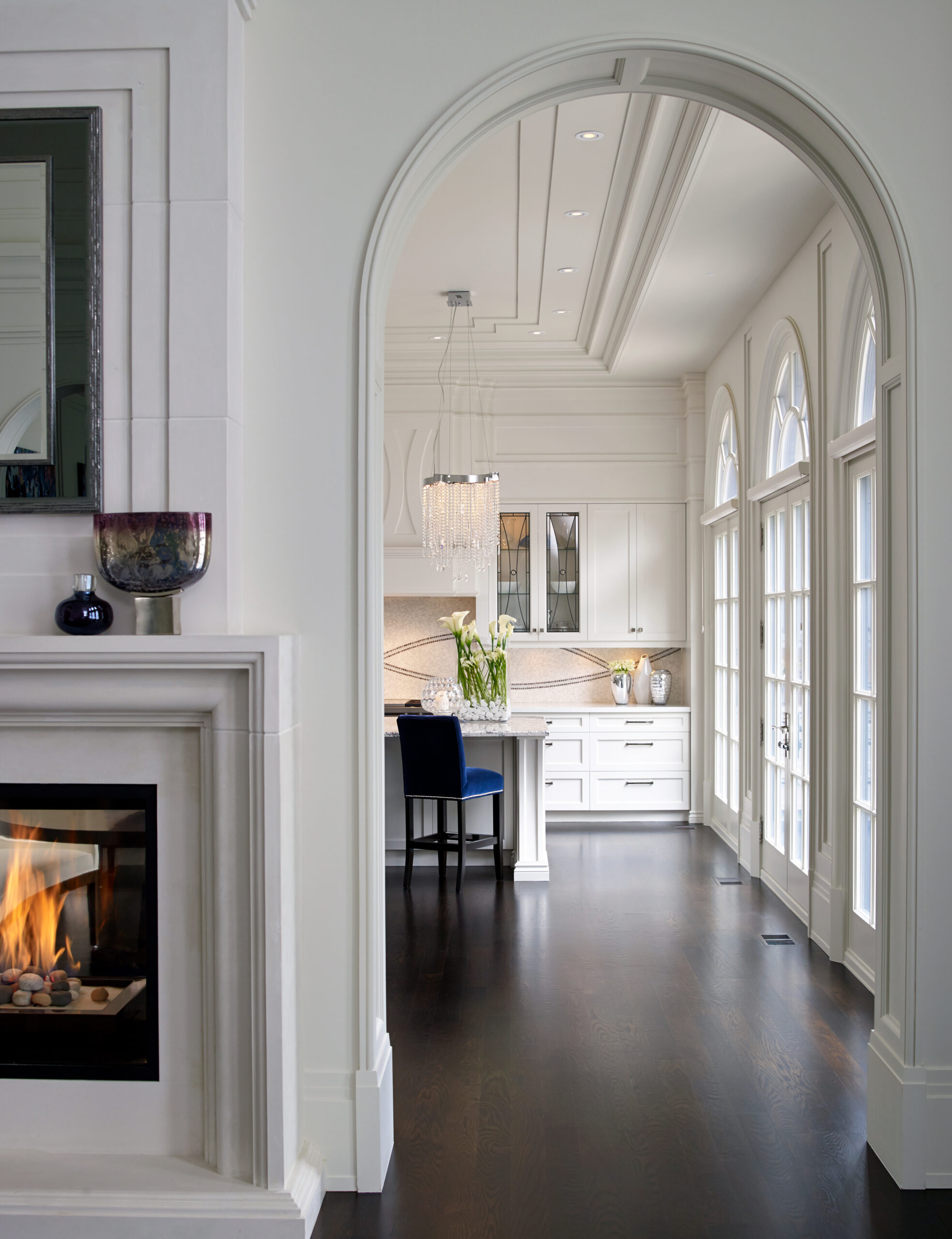 View of kitchen through arched doorway