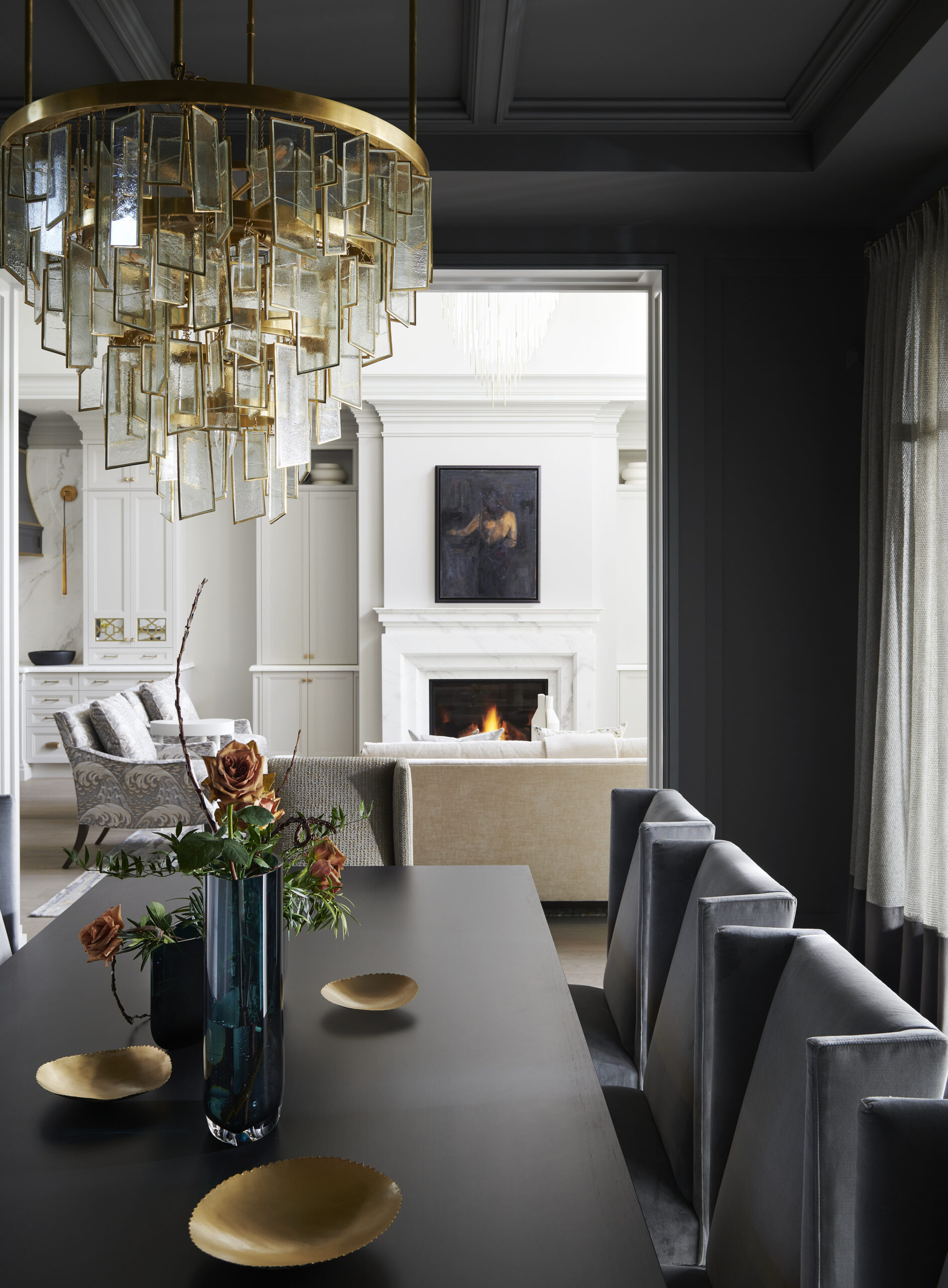 Chateau on the Lake - Glass wall - Golden chandelier above a dinning table