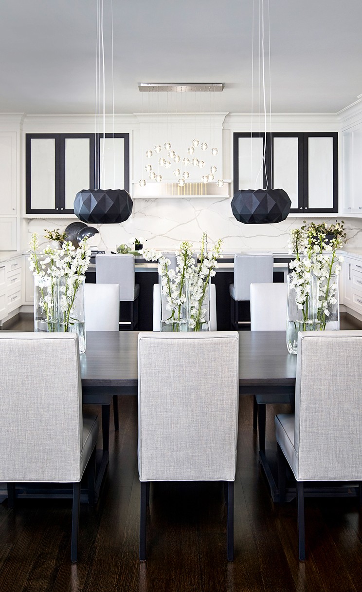 Dining area with kitchen in background