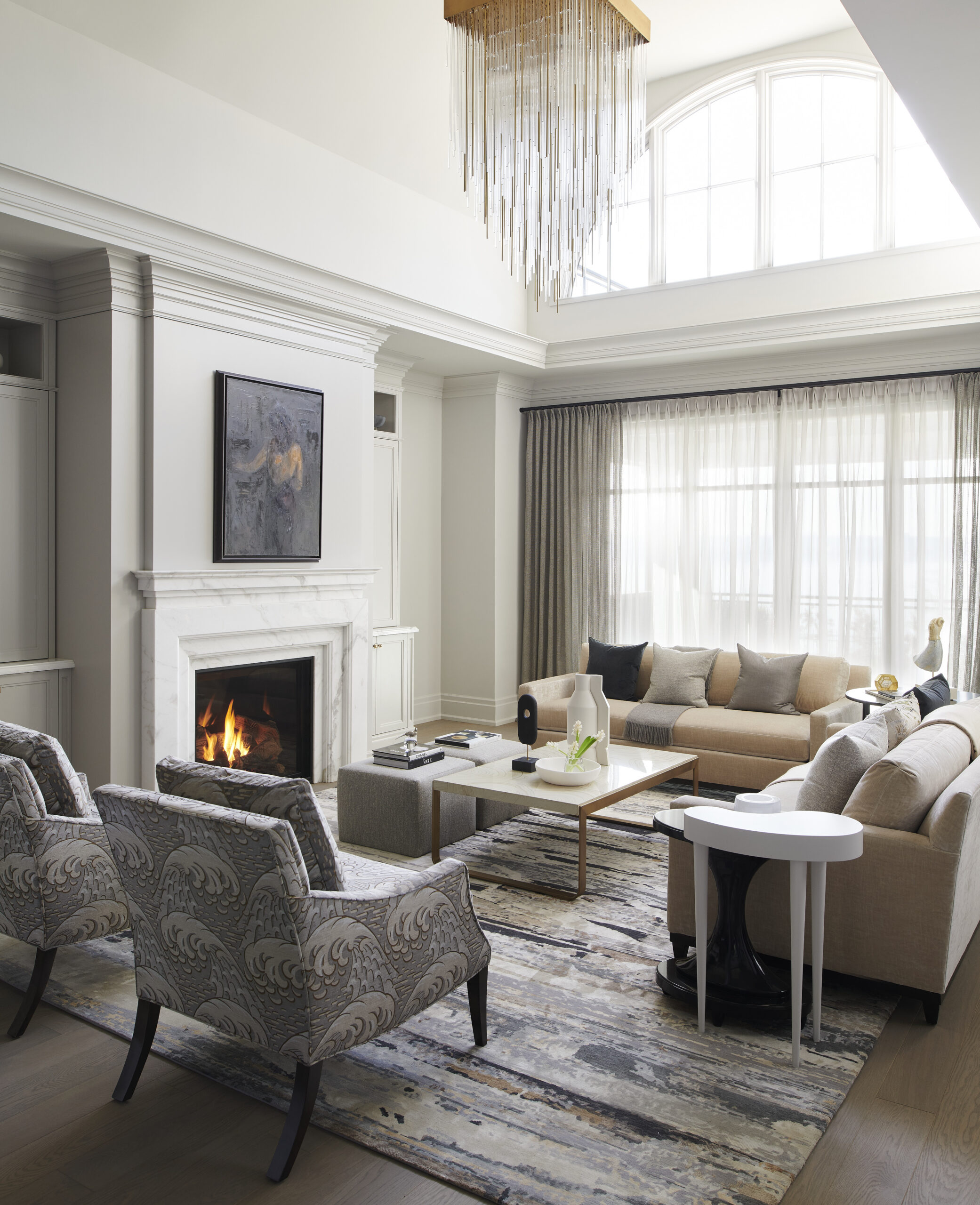 Chateau on the Lake - Modern living room with big floor-to-ceiling windows for lots of natural light