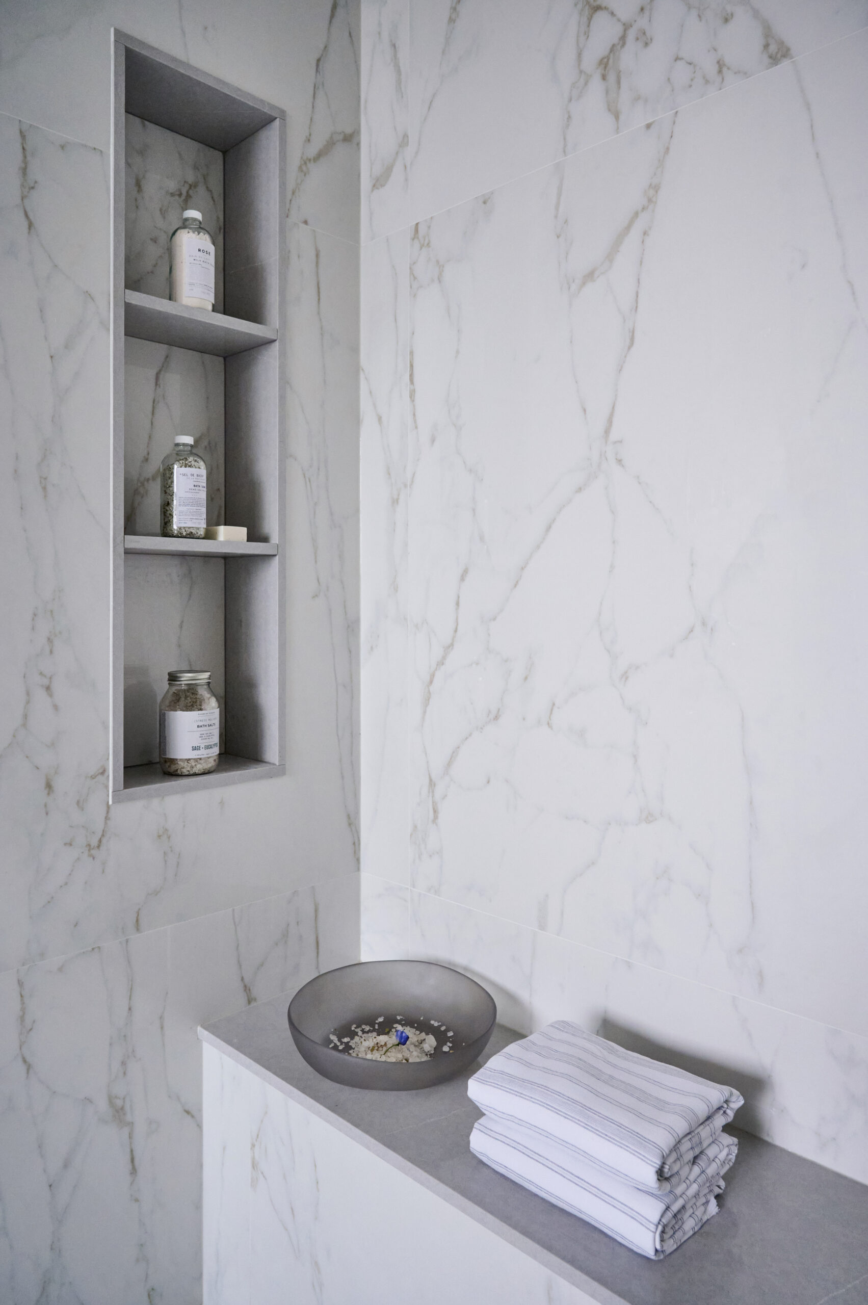 White marble shelves in shower