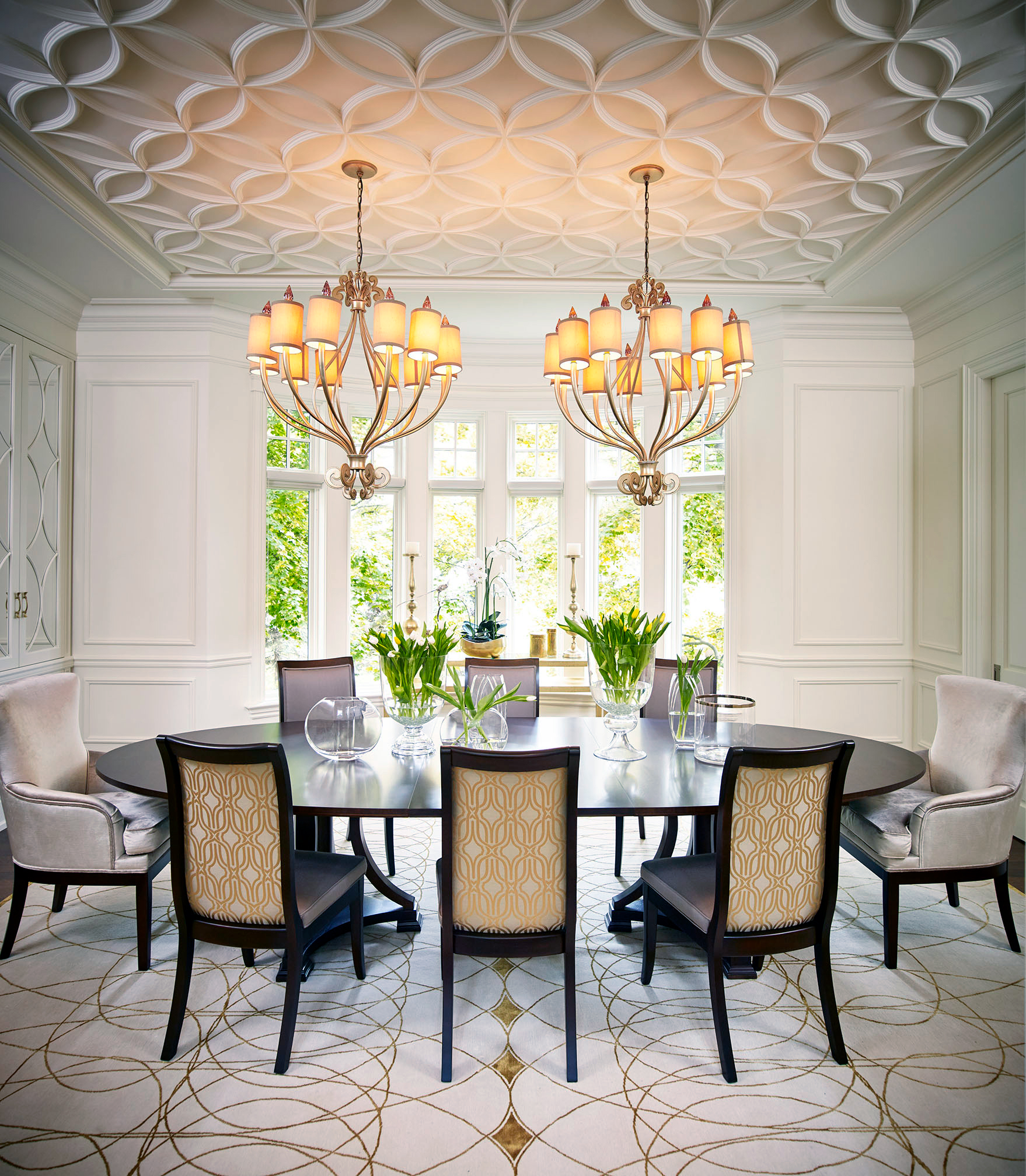 Warm dining room with black and white charis
